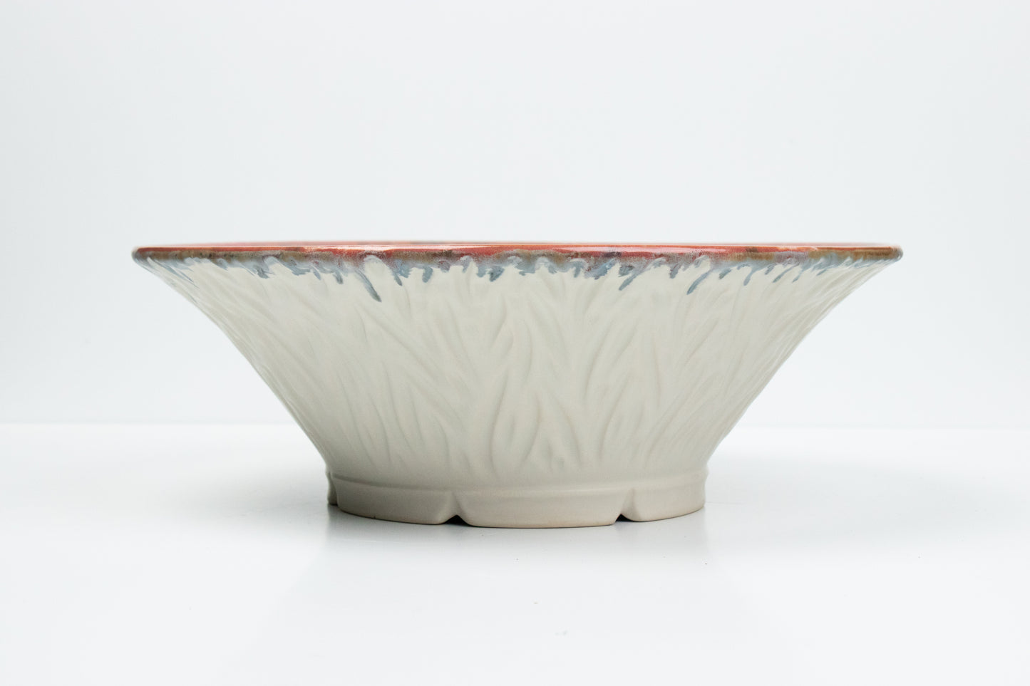 Carved White Bowl with Drippy Pink Glaze